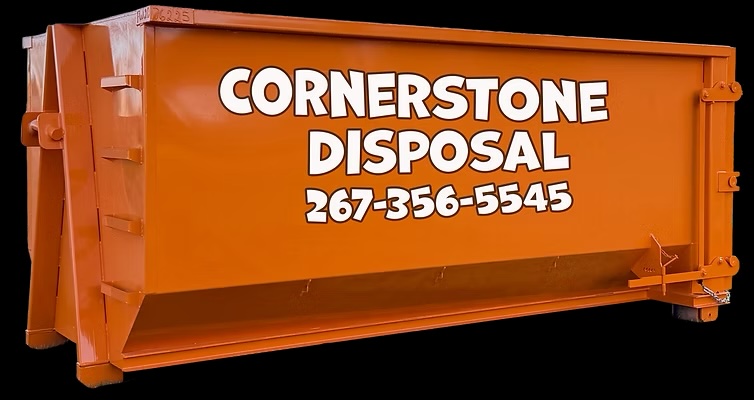 20-yard orange dumpster from Cornerstone Disposal placed on a residential driveway